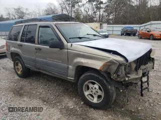 1996 Jeep Grand Cherokee Laredo with VIN 1J4FX58S5TC248122, listed as a Copart auction lot 45843935 with 295,521 mi miles and Salvage Title. Bid and sale history available at carsss.com. Image 4.
