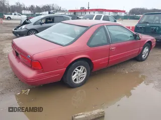 1997 Ford Thunderbird LX with VIN 1FALP6248VH134894, listed as a IAAI auction lot 41551957 with 136,435 mi miles and . Bid and sale history available at DreamBid. Image 4.