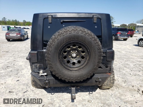 2013 Jeep Wrangler Unlimited Moab with VIN 1C4HJWEG7DL600043, listed as a Copart auction lot 52146945 with 118,882 mi miles and Salvage title. Bid and sale history available at DreamBid. Image 6.