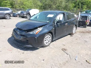 2022 Toyota Prius L Eco with VIN JTDKAMFU1N3182790, listed as a IAAI auction lot 41993264 with 124,777 mi miles and . Bid and sale history available at DreamBid. Image 2.
