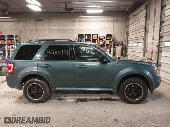 2011 Ford Escape XLT with VIN 1FMCU0D70BKB25088, listed as a IAAI auction lot 42004191 with 200,665 mi miles. Bid and sale history available at carsss.com. Image 13.