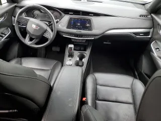 2019 Cadillac XT4 FWD Premium Luxury z VIN 1GYFZCR49KF147242, wystawiony jako Copart lot #55483215 z przebiegiem 94 990 mil mil oraz Szkody całkowita. Historia ofert i sprzedaży dostępna na DreamBid. Obrazek 8.