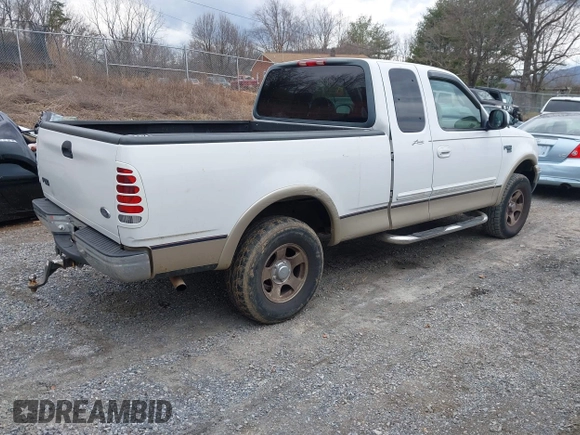 1999 Ford F-150 XL with VIN 1FTRX18LXXKA75357, listed as a IAAI auction lot 41630371 with 202,021 mi miles. Bid and sale history available at carsss.com. Image 4.