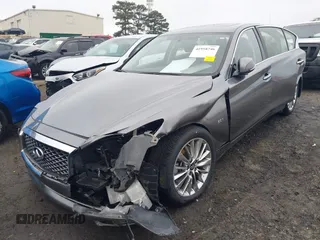 2019 Infiniti Q50 Luxe z VIN JN1EV7AP5KM518681, wystawiony jako IAAI lot #41958746 z przebiegiem 66 629 mil mil oraz . Historia ofert i sprzedaży dostępna na DreamBid. Obrazek 6.