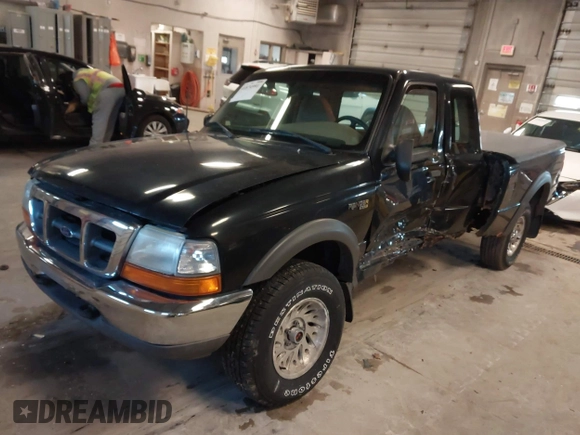 1999 Ford Ranger XL with VIN 1FTZR15V4XPB56809, listed as a IAAI auction lot 41874991 with 165,487 mi miles. Bid and sale history available at carsss.com. Image 2.