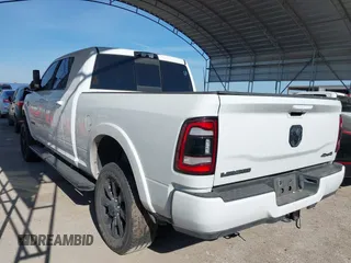 2021 Ram 2500 Laramie with VIN 3C6UR5NLXMG677847, listed as a IAAI auction lot 40992410 with 106,912 mi miles. Bid and sale history available at carsss.com. Image 3.