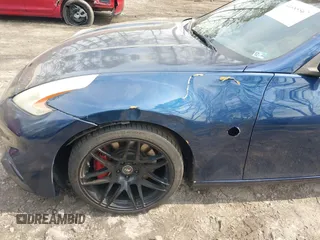 2014 Nissan 370Z Nismo z VIN JN1AZ4EH0EM631950, wystawiony jako IAAI lot #41685567 z przebiegiem 103 282 mil mil oraz . Historia ofert i sprzedaży dostępna na DreamBid. Obrazek 6.