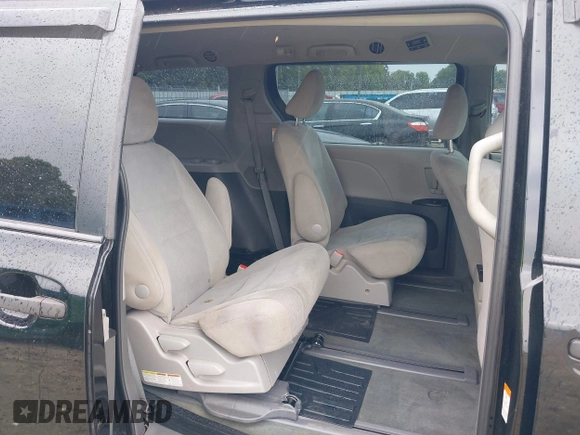 2015 Toyota Sienna L z VIN 5TDZK3DCXFS662049, wystawiony jako IAAI lot #42397319 z przebiegiem 202 960 mil mil oraz . Historia ofert i sprzedaży dostępna na DreamBid. Obrazek 8.