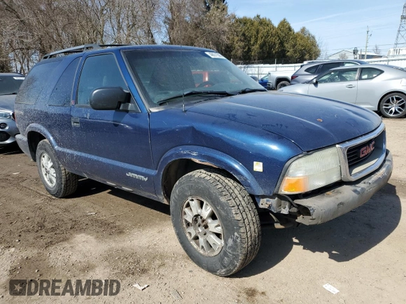2003 GMC Jimmy z VIN 1GKCT18X43K110056, wystawiony jako Copart lot #48671585 z przebiegiem 272 867 mil mil oraz Czysty tytuł • Clean title. Historia ofert i sprzedaży dostępna na DreamBid. Obrazek 4.