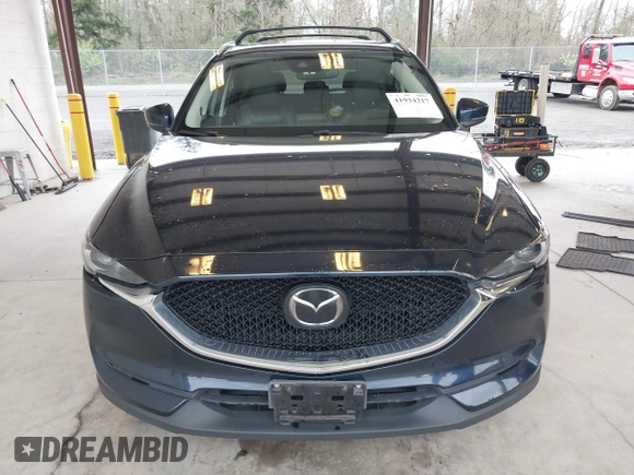 2018 Mazda CX-5 Grand Touring with VIN JM3KFBDM4J0302870, listed as a IAAI auction lot 41934217 with 57,151 mi miles. Bid and sale history available at carsss.com. Image 13.