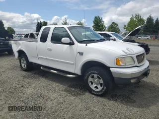 2002 Ford F-150 XL with VIN 1FTRX18L62KC53807, listed as a Copart auction lot 57463075 with 173,301 mi miles and Salvage title. Bid and sale history available at DreamBid. Image 4.