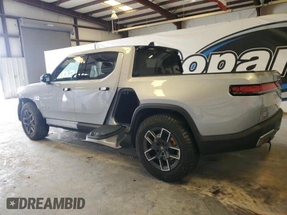 2022 Rivian R1T Launch Edition z VIN 7FCTGAAL7NN006406, wystawiony jako Copart lot #60049275 z przebiegiem 1 517 mil mil oraz Czysty tytuł • Clean title. Historia ofert i sprzedaży dostępna na DreamBid. Obrazek 3.