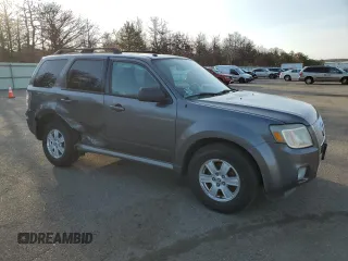 2010 Mercury Mariner z VIN 4M2CN9B70AKJ28137, wystawiony jako Copart lot #48926345 z przebiegiem 100 975 mil mil oraz Szkody całkowita. Historia ofert i sprzedaży dostępna na DreamBid. Obrazek 4.