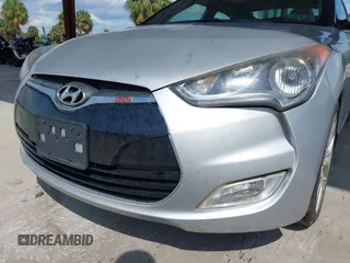 2012 Hyundai Veloster w/Gray Int z VIN KMHTC6ADXCU056898, wystawiony jako IAAI lot #40366687 z przebiegiem 137 161 mil mil oraz . Historia ofert i sprzedaży dostępna na DreamBid. Obrazek 6.
