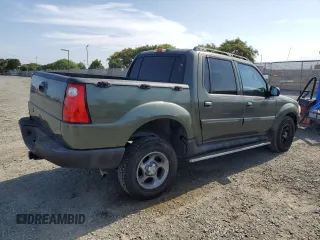 2004 Ford Explorer Sport Trac XLS with VIN 1FMZU67K64UA39174, listed as a Copart auction lot 61035465 with 196,912 mi miles and Salvage title. Bid and sale history available at DreamBid. Image 3.