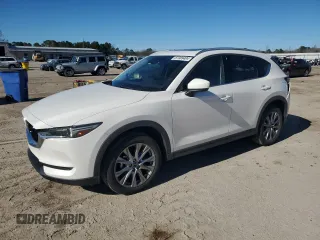 2021 Mazda CX-5 Grand Touring with VIN JM3KFBDM0M1440565, listed as a Copart auction lot 87089404 with 34,607 mi miles and Salvage Title. Bid and sale history available at carsss.com. Image 1.
