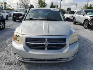 2009 Dodge Caliber SXT with VIN 1B3HB48AX9D157186, listed as a Copart auction lot 52892065 with 218,024 mi miles and Salvage Title. Bid and sale history available at carsss.com. Image 5.