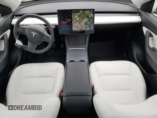 2022 Tesla Model Y Long Range with VIN 7SAYGDEE1NF315198, listed as a Copart auction lot 50399005 with 33,357 mi miles and Salvage Title. Bid and sale history available at DreamBid. Image 8.