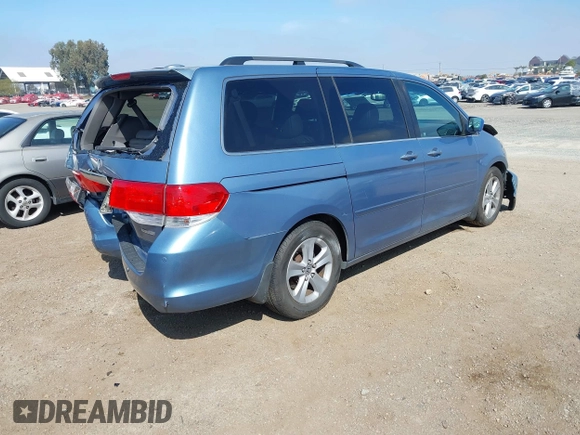 2010 Honda Odyssey Touring with VIN 5FNRL3H92AB056186, listed as a IAAI auction lot 41851386 with 199,109 mi miles. Bid and sale history available at carsss.com. Image 4.