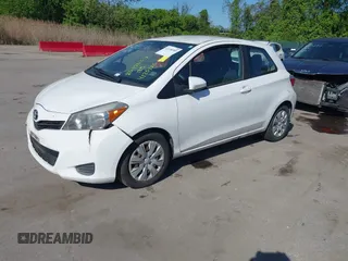 2014 Toyota Yaris L with VIN VNKJTUD35EA011933, listed as a IAAI auction lot 42150303 with 114,369 mi miles. Bid and sale history available at carsss.com. Image 2.