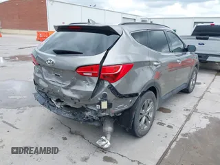 2014 Hyundai Santa Fe with VIN 5XYZU3LB2EG155127, listed as a IAAI auction lot 41864518 with Not provided miles and . Bid and sale history available at DreamBid. Image 4.