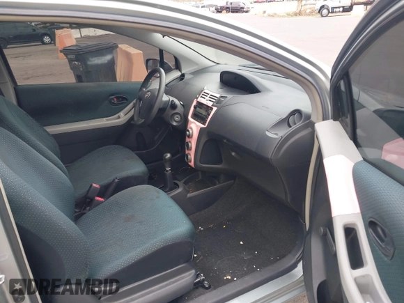 2007 Toyota Yaris with VIN JTDJT923675117537, listed as a IAAI auction lot 42116893 with 210,036 mi miles. Bid and sale history available at carsss.com. Image 5.