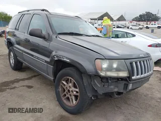 2004 Jeep Grand Cherokee Laredo z VIN 1J4GX48S34C214485, wystawiony jako IAAI lot #42208120 z przebiegiem 164 322 mil mil oraz . Historia ofert i sprzedaży dostępna na DreamBid. Obrazek 1.