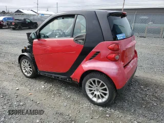 2011 Smart fortwo Pure z VIN WMEEJ3BA5BK487747, wystawiony jako Copart lot #49703445 z przebiegiem 93 489 mil mil oraz Szkoda całkowita • Salvage title. Historia ofert i sprzedaży dostępna na DreamBid. Obrazek 2.