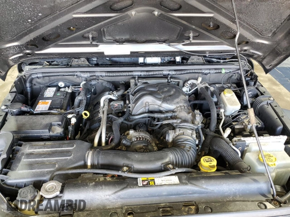 2016 Jeep Wrangler Sport z VIN 1C4GJWAG1GL192158, wystawiony jako Copart lot #53303845 z przebiegiem 99 812 mil mil oraz Szkoda całkowita • Salvage title. Historia ofert i sprzedaży dostępna na DreamBid. Obrazek 11.