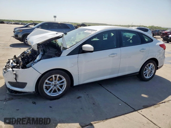 2018 Ford Focus SE z VIN 1FADP3F29JL225126, wystawiony jako Copart lot #52817265 z przebiegiem Nie podano mil oraz Szkoda całkowita • Salvage title. Historia ofert i sprzedaży dostępna na DreamBid. Obrazek 1.