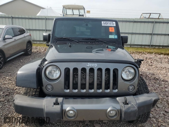 2015 Jeep Wrangler Unlimited Freedom with VIN 1C4BJWDG4FL568601, listed as a Copart auction lot 64041415 with 128,874 mi miles and Salvage title. Bid and sale history available at DreamBid. Image 5.
