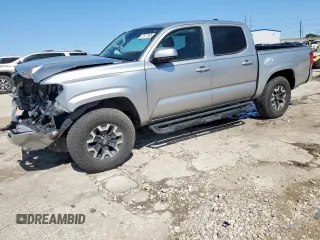 2023 Toyota Tacoma SR with VIN 3TMCZ5AN1PM648285, listed as a Copart auction lot 57577185 with 32,209 mi miles and Salvage title. Bid and sale history available at DreamBid. Image 1.