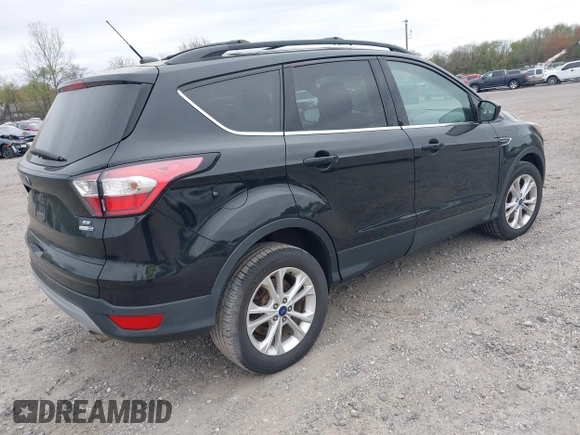 2017 Ford Escape SE with VIN 1FMCU9GD0HUC58128, listed as a IAAI auction lot 42078045 with 125,503 mi miles. Bid and sale history available at carsss.com. Image 4.