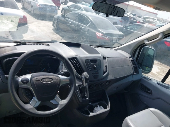 2015 Ford Transit Cargo with VIN 1FTNE2CMXFKA06516, listed as a IAAI auction lot 41650498 with 281,654 mi miles and . Bid and sale history available at carsss.com. Image 18.