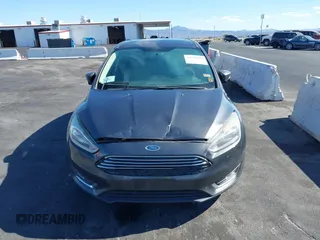 2017 Ford Focus Titanium with VIN 1FADP3N25HL299817, listed as a IAAI auction lot 42161440 with 154,974 mi miles and . Bid and sale history available at carsss.com. Image 6.