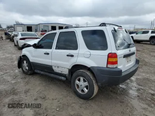2004 Ford Escape XLS with VIN 1FMYU02144DA18217, listed as a Copart auction lot 43136895 with 135,424 mi miles and Salvage Title. Bid and sale history available at DreamBid. Image 2.