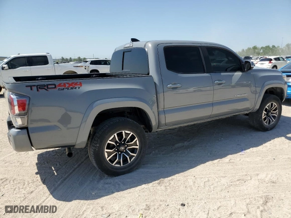 2021 Toyota Tacoma 4WD SR with VIN 3TMCZ5AN2MM436040, listed as a Copart auction lot 52879625 with 27,244 mi miles and Salvage Title. Bid and sale history available at carsss.com. Image 3.