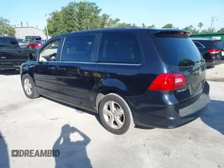 2011 Volkswagen Routan SE with VIN 2V4RW3DG5BR668194, listed as a IAAI auction lot 42483379 with 203,945 mi miles and . Bid and sale history available at DreamBid. Image 3.