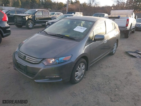 2010 Honda Insight LX with VIN JHMZE2H52AS014667, listed as a IAAI auction lot 41258620 with 138,419 mi miles. Bid and sale history available at carsss.com. Image 2.