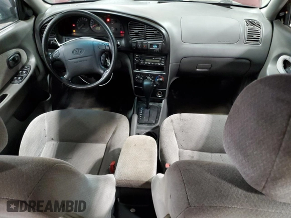 2003 Kia Spectra with VIN KNAFB121735217341, listed as a Copart auction lot 72016504 with 116,224 mi miles and Salvage Title. Bid and sale history available at DreamBid. Image 8.