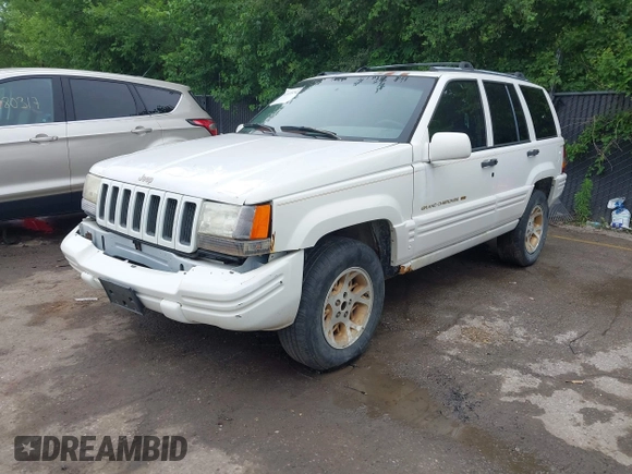 1997 Jeep Grand Cherokee Limited z VIN 1J4GZ78S1VC536295, wystawiony jako IAAI lot #42435292 z przebiegiem 310 005 mil mil oraz . Historia ofert i sprzedaży dostępna na DreamBid. Obrazek 18.