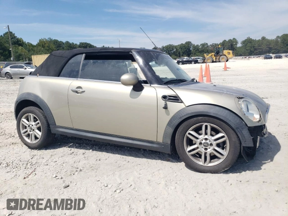 2011 MINI Convertible with VIN WMWZN3C54BT133246, listed as a Copart auction lot 69780074 with 176,955 mi miles and Salvage title. Bid and sale history available at DreamBid. Image 4.