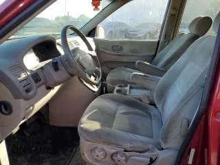2005 Kia Sedona LX with VIN KNDUP132156669009, listed as a Copart auction lot 76936094 with 124,989 mi miles and Salvage Title. Bid and sale history available at carsss.com. Image 7.