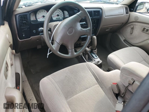 2002 Toyota Tacoma with VIN 5TEWM72N12Z093226, listed as a Copart auction lot 61019955 with 103,657 mi miles and Clean title. Bid and sale history available at DreamBid. Image 8.