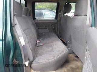 2000 Nissan Frontier XE with VIN 1N6ED27T5YC429406, listed as a IAAI auction lot 42150671 with 303,869 mi miles and . Bid and sale history available at DreamBid. Image 8.