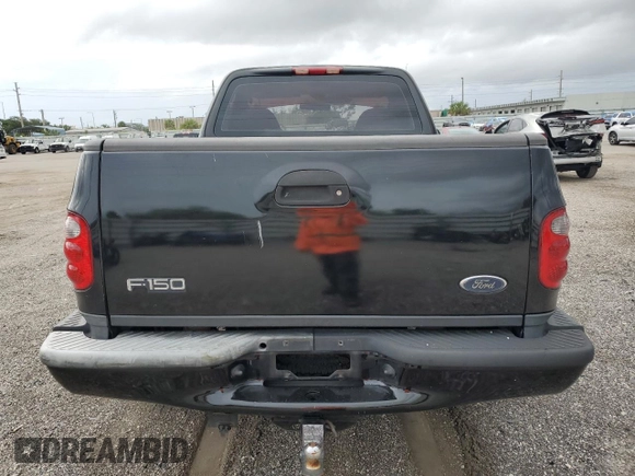 2003 Ford F-150 XL with VIN 1FTRF07W33KB56591, listed as a Copart auction lot 64170993 with 150,941 mi miles and Salvage title. Bid and sale history available at DreamBid. Image 6.