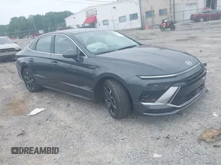 2024 Hyundai Sonata SEL z VIN KMHL64JAXRA374693, wystawiony jako IAAI lot #42216729 z przebiegiem 23 973 mil mil oraz . Historia ofert i sprzedaży dostępna na DreamBid. Obrazek 1.