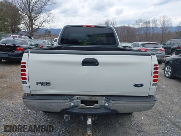 1999 Ford F-150 XL with VIN 1FTRX18LXXKA75357, listed as a IAAI auction lot 41630371 with 202,021 mi miles. Bid and sale history available at carsss.com. Image 17.