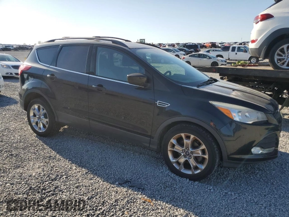 2014 Ford Escape SE with VIN 1FMCU0GX7EUB42975, listed as a Copart auction lot 52605765 with 138,523 mi miles and Salvage Title. Bid and sale history available at DreamBid. Image 4.
