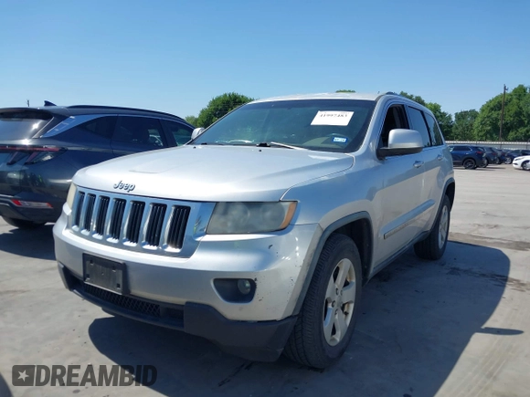 2012 Jeep Grand Cherokee Laredo with VIN 1C4RJEAG5CC112230, listed as a IAAI auction lot 41997483 with 302,923 mi miles. Bid and sale history available at carsss.com. Image 18.